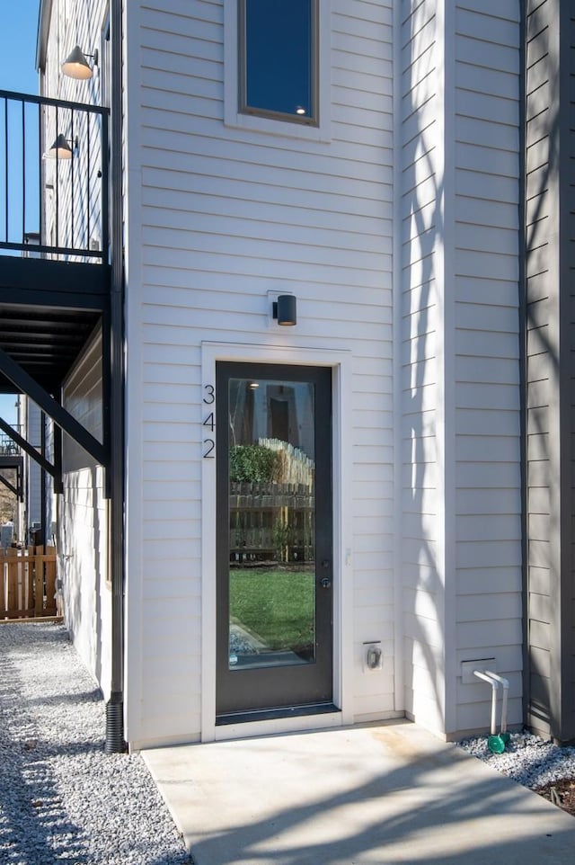 entrance to property featuring a patio area