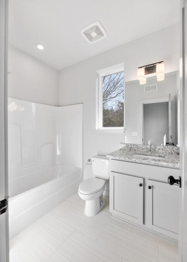 full bathroom featuring vanity, shower / bathtub combination, and toilet