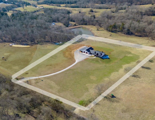 birds eye view of property with a rural view