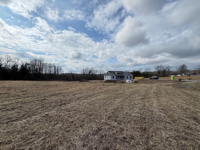 view of yard with a rural view