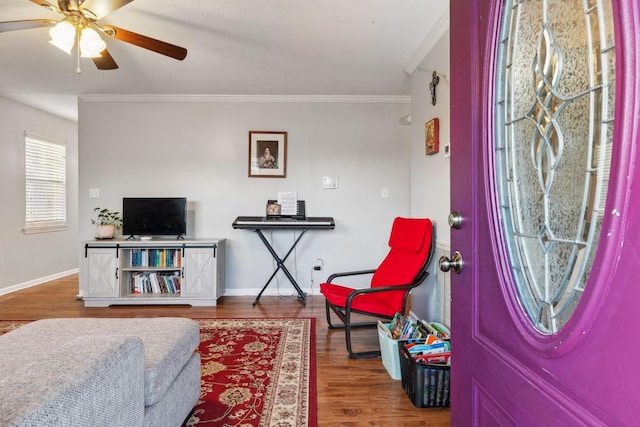 entryway featuring crown molding, hardwood / wood-style floors, and ceiling fan