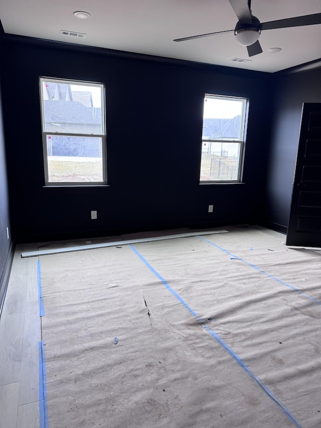 unfurnished room featuring ceiling fan