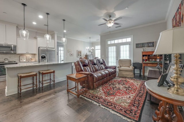 living room featuring ornamental molding, dark hardwood / wood-style floors, ceiling fan, and french doors