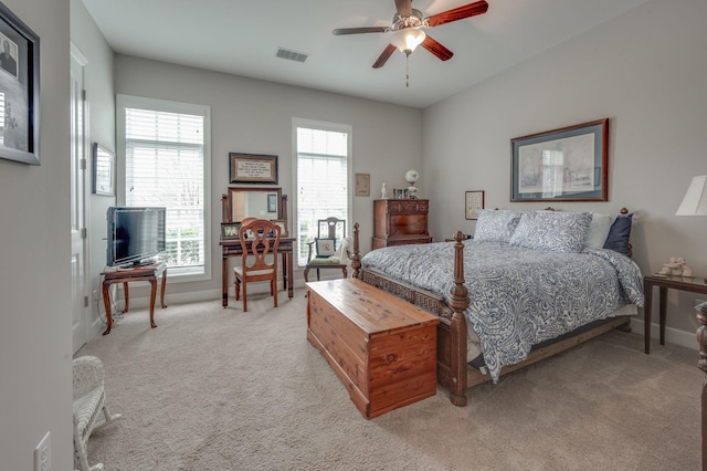 bedroom featuring ceiling fan and light carpet