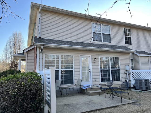 back of house with central AC and a patio