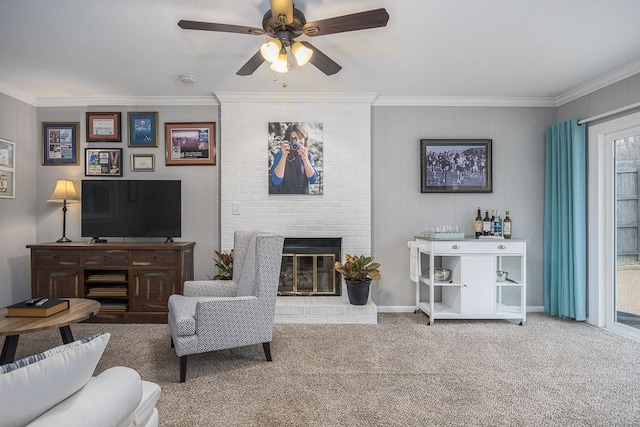 living room featuring light colored carpet, a fireplace, ornamental molding, and ceiling fan