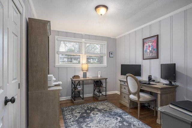 home office featuring dark hardwood / wood-style flooring and crown molding