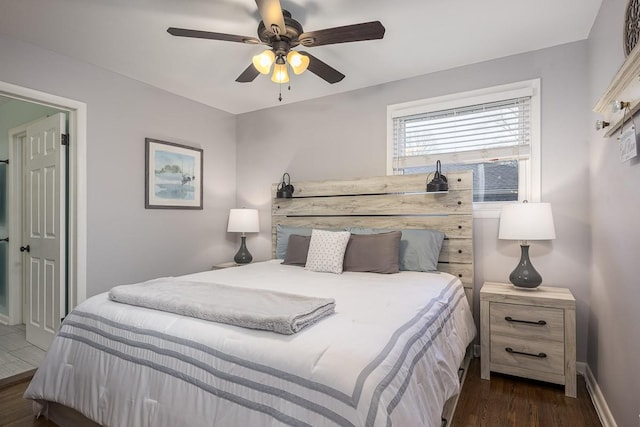 bedroom with ceiling fan and dark hardwood / wood-style flooring