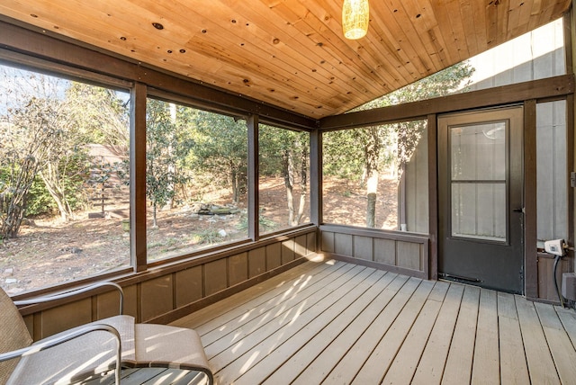 unfurnished sunroom with vaulted ceiling and wooden ceiling