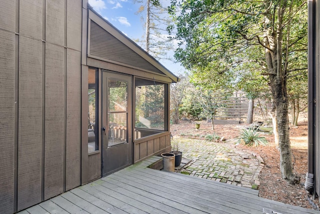 wooden deck featuring a sunroom