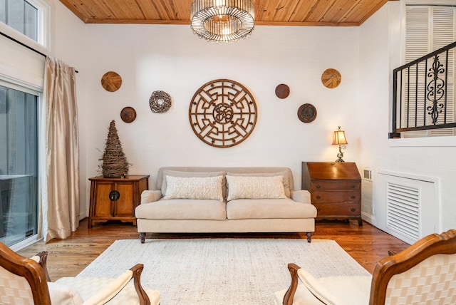 living room with wood ceiling and wood-type flooring