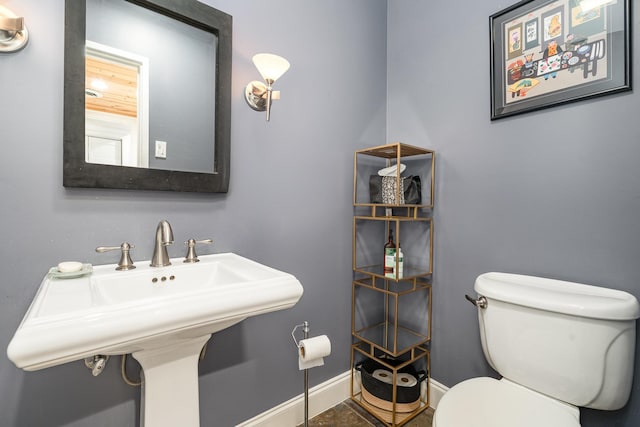 bathroom with toilet and sink