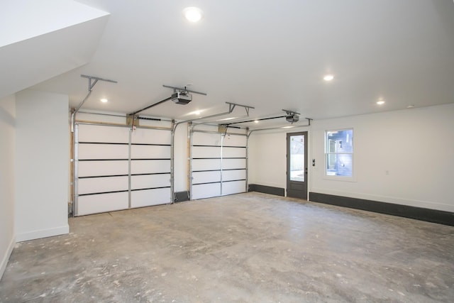 garage with baseboards and a garage door opener