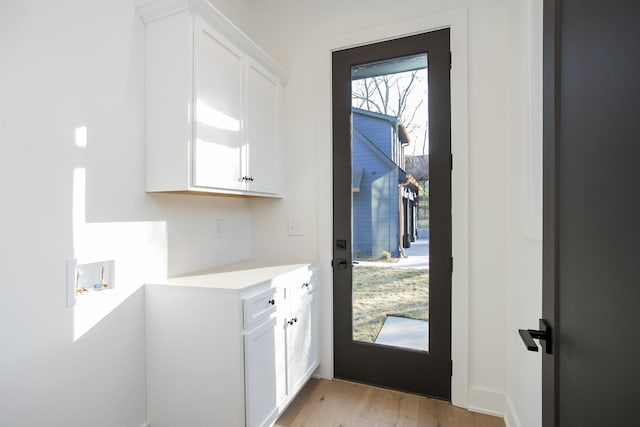 doorway featuring light hardwood / wood-style floors