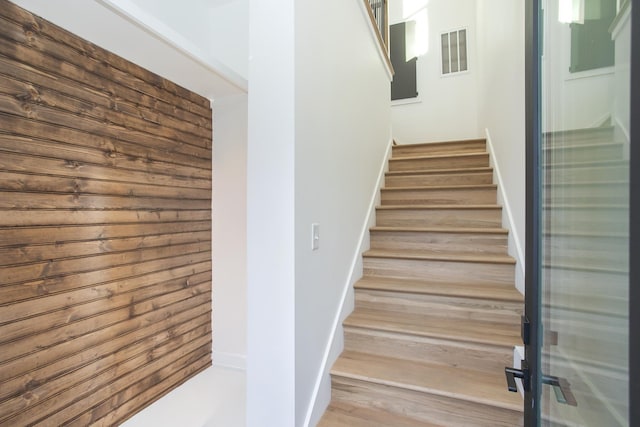 stairway featuring hardwood / wood-style flooring