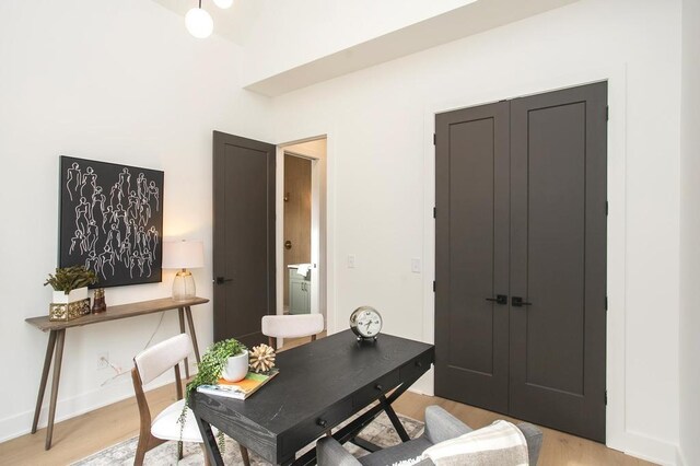 office featuring light wood-style floors and baseboards