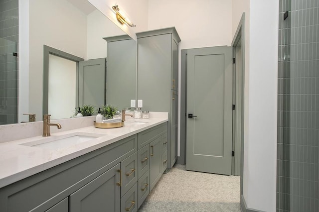 full bathroom with double vanity and a sink