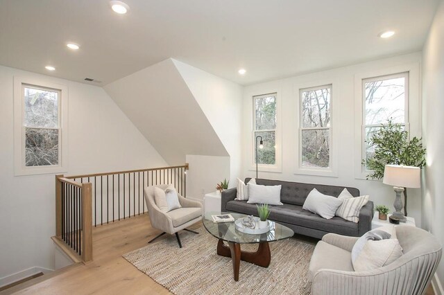 interior space with plenty of natural light, light wood-style flooring, and recessed lighting