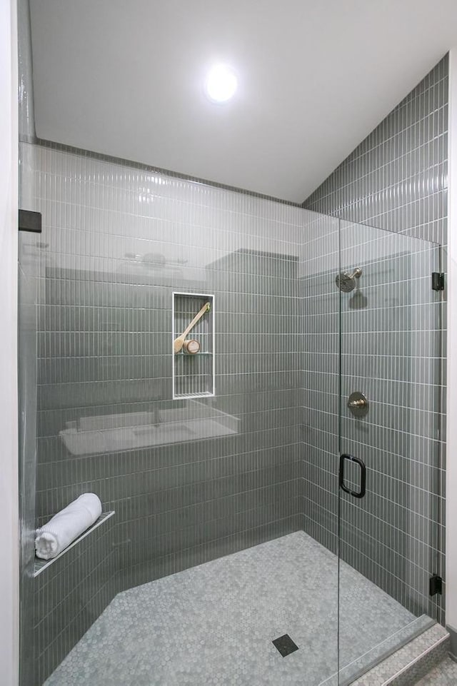 bathroom with a shower stall