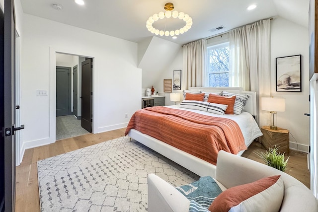 bedroom with baseboards, visible vents, vaulted ceiling, light wood-type flooring, and recessed lighting