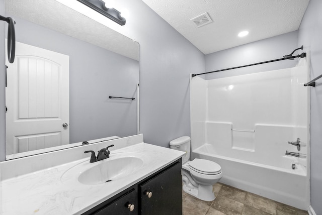 full bathroom featuring shower / washtub combination, toilet, a textured ceiling, and vanity