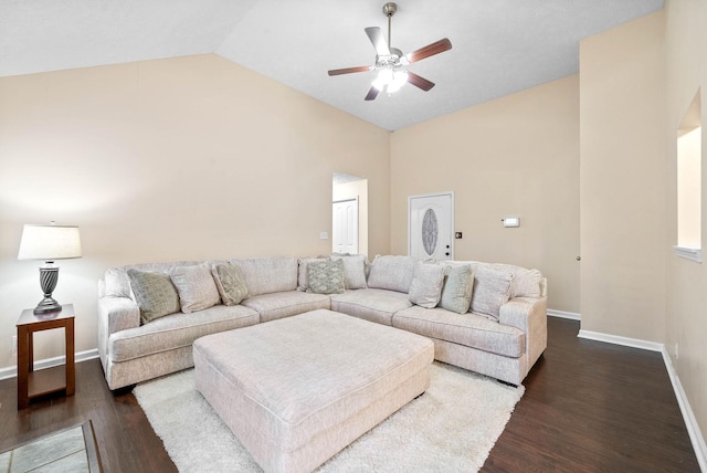 living room with lofted ceiling, dark hardwood / wood-style floors, and ceiling fan