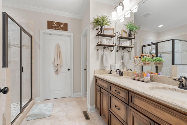 bathroom featuring a shower with door, vanity, and ornamental molding