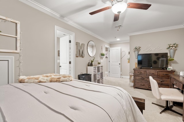 bedroom featuring crown molding, light colored carpet, ceiling fan, and ensuite bath