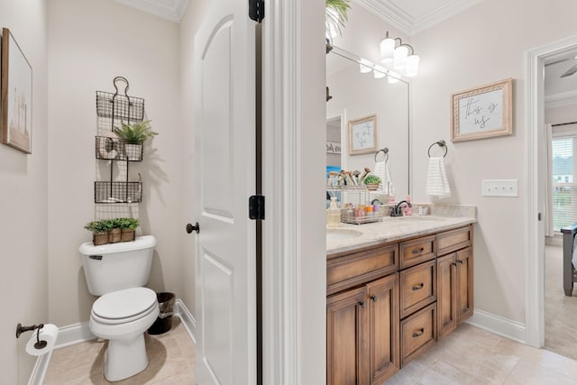 bathroom featuring vanity, crown molding, tile patterned floors, and toilet