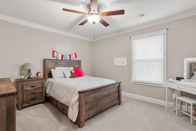 carpeted bedroom featuring ceiling fan and ornamental molding