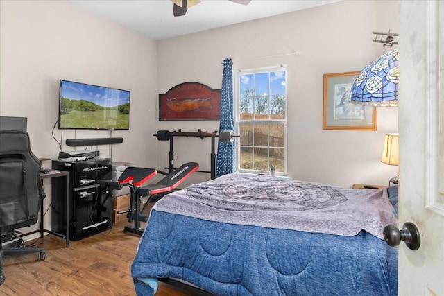 bedroom featuring wood-type flooring and ceiling fan