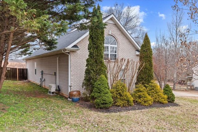 view of home's exterior featuring a yard