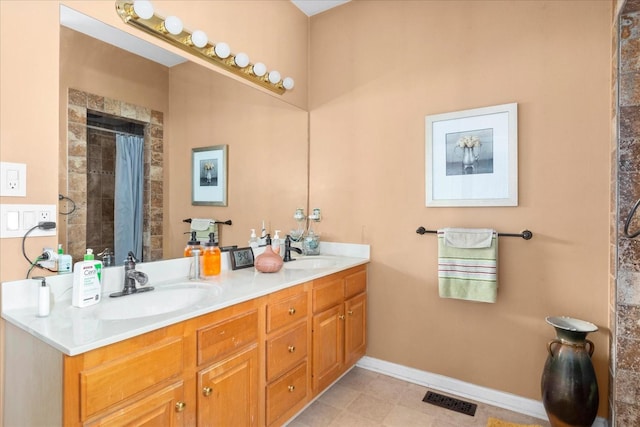 bathroom with vanity and a shower with shower curtain