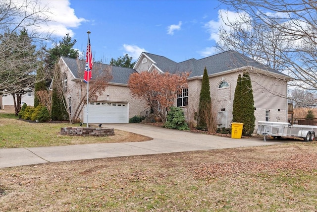 front of property featuring a garage and a front lawn