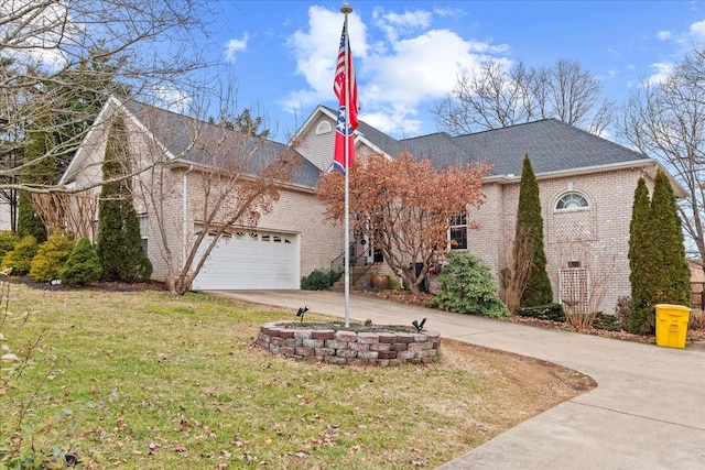 view of front of house featuring a garage and a front yard