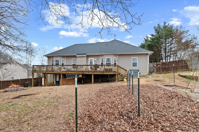 rear view of property featuring a deck