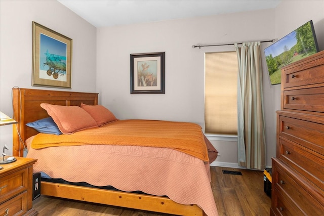 bedroom featuring dark wood-type flooring