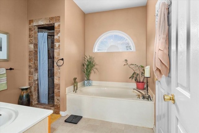 bathroom featuring vanity and shower with separate bathtub