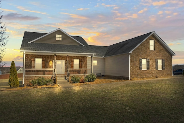 view of front of property featuring a yard and a porch