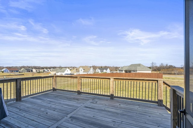 wooden terrace with a lawn