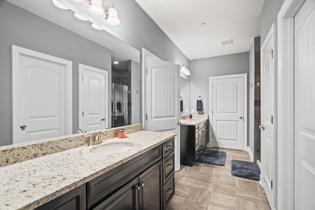 bathroom with vanity and walk in shower