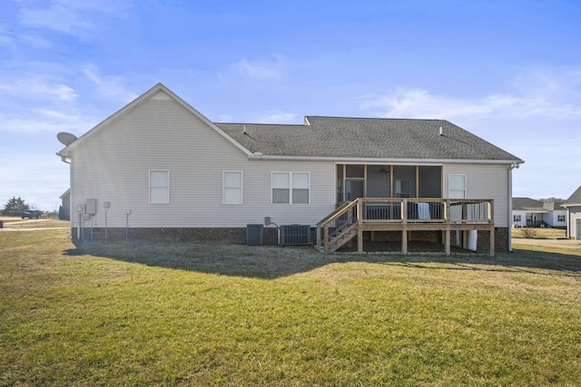 back of house featuring central AC, a yard, and a deck