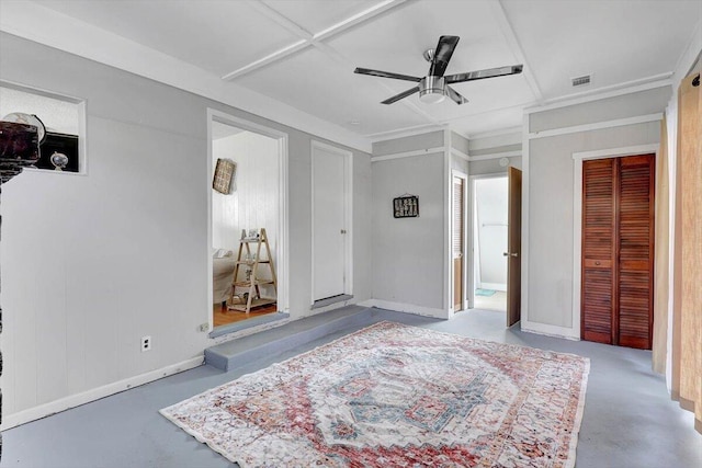 bedroom with concrete floors and ceiling fan