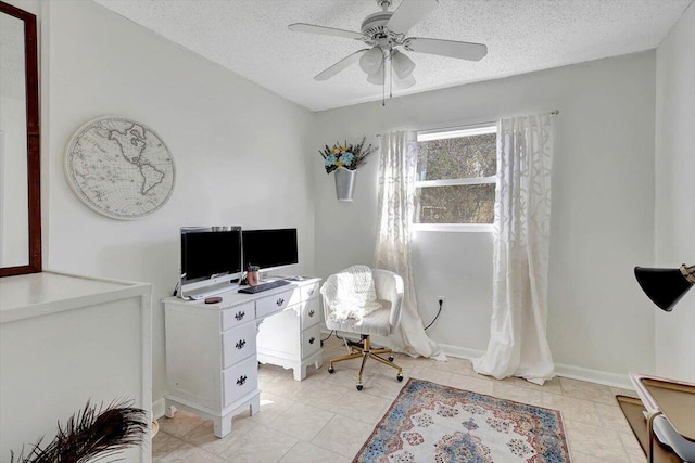 office with light tile patterned flooring, ceiling fan, and a textured ceiling