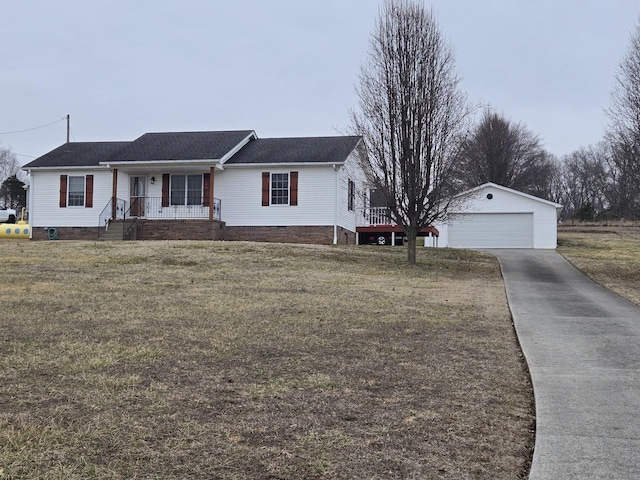 ranch-style home featuring a porch, a garage, an outdoor structure, and a front lawn