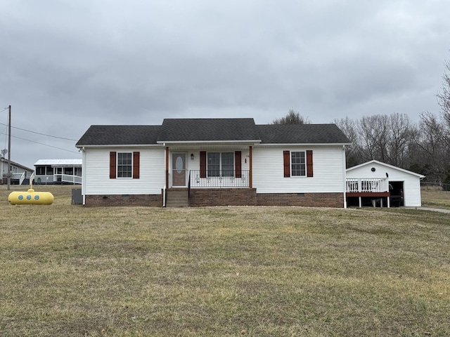 view of front of home featuring a garage, a front yard, and covered porch