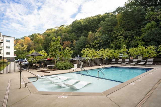 view of swimming pool featuring a patio area