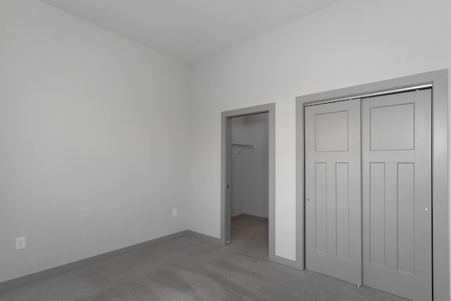 unfurnished bedroom with light colored carpet