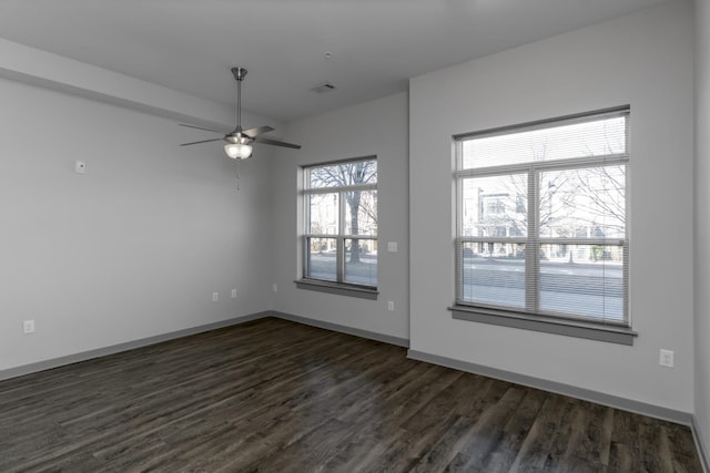 unfurnished room with ceiling fan and dark hardwood / wood-style flooring