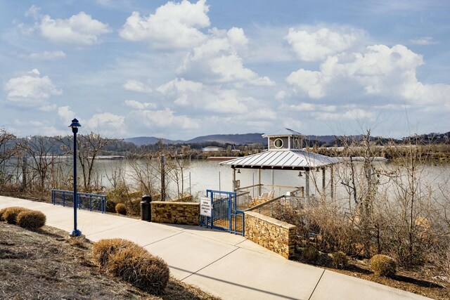 dock area featuring a gazebo and a water and mountain view